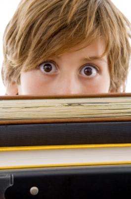 Eyelash view boy with books