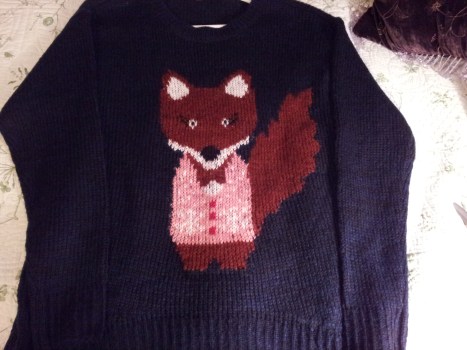 What does my sweater say?