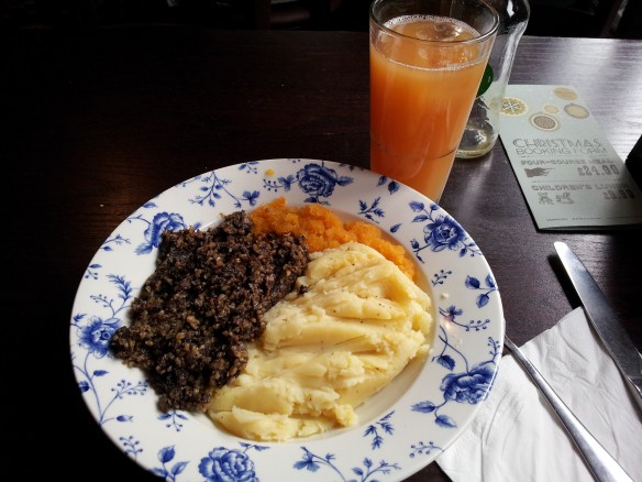 Haggis (the national dish of Scotland), neeps (swede turnips), and tatties (potatoes). Haggis is very rich, very meaty and spicy. It's not bad, if you forget what it's made of (sheep offal).