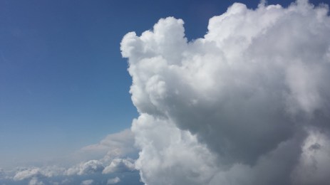 For example, you can’t describe the poofy marshmallow mountains of clouds until you fly right by them.